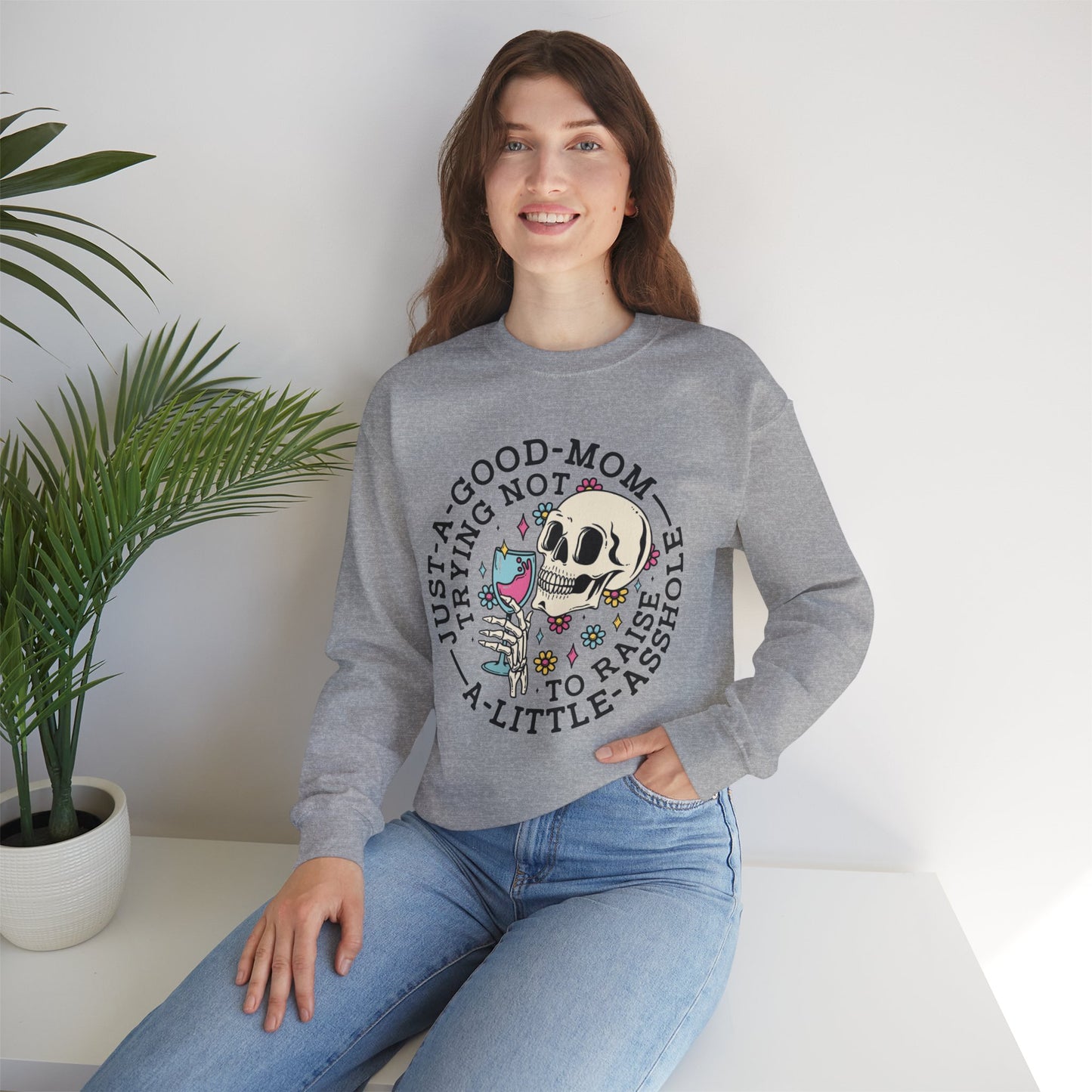 Just a Good Mom Trying Not to Raise a Little Asshole Crewneck Sweatshirt - Funny Skull Design
